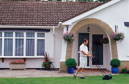 a man moaning the law in front of his house